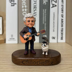Real product photo of a personalized ChronoFig An elderly man playing the guitar 3D figurine created from a photo and displayed on a wooden base.
