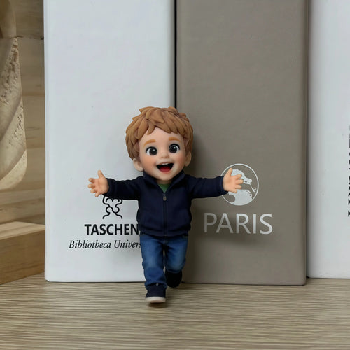 Real product photo of a personalized ChronoFig Little boy 3D figurine created from a photo and displayed on a wooden base.
