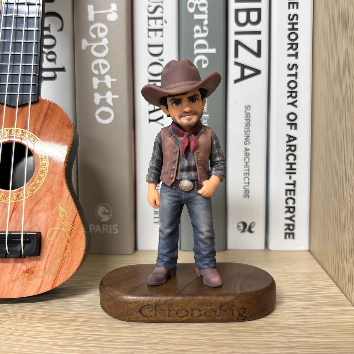 Real product photo of a personalized ChronoFig cowboy 3D figurine created from a photo and displayed on a wooden base.